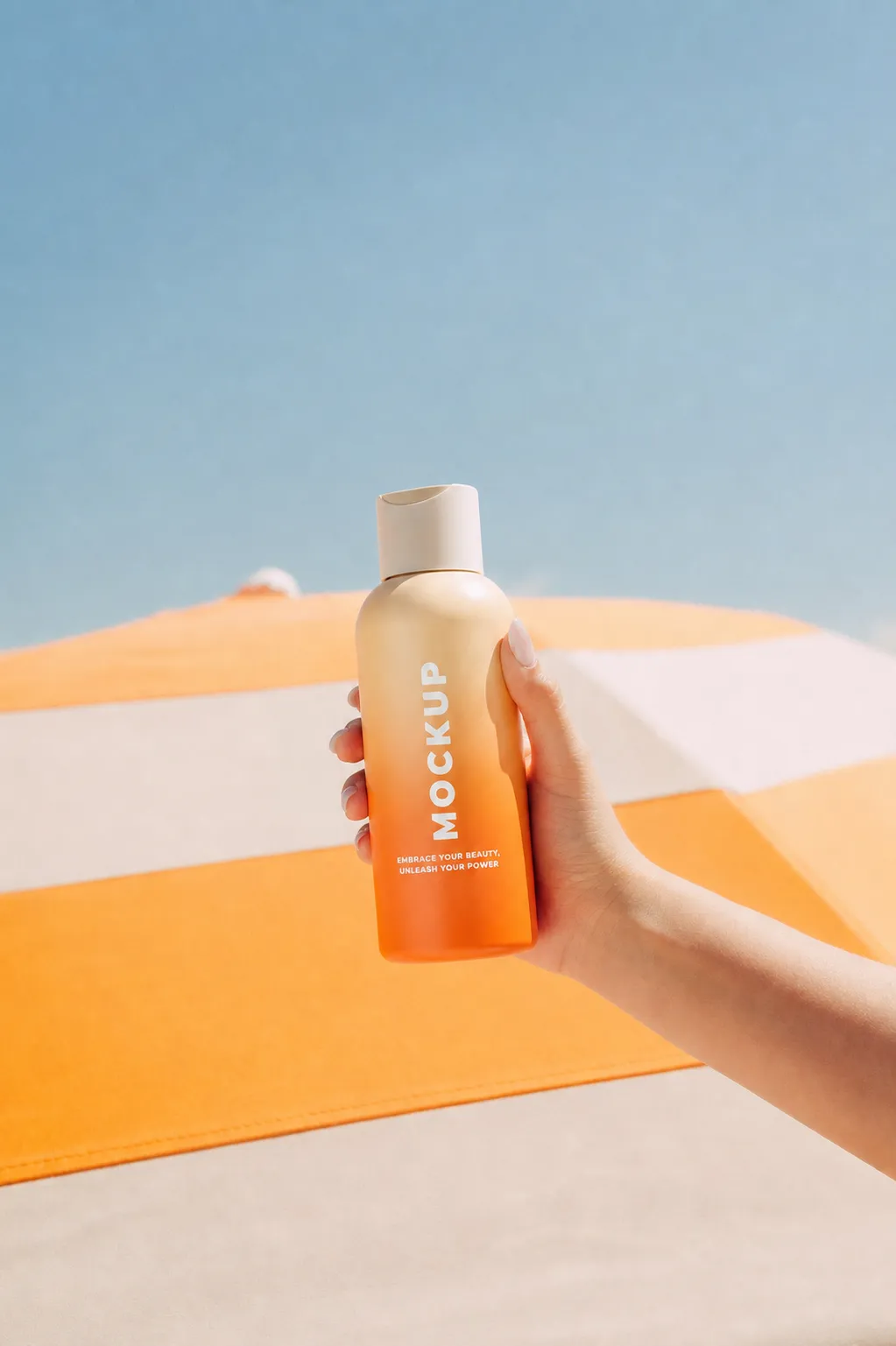 Hand holding orange bottle mockup at beach｜AI Image Generation Prompts